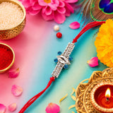 Silver Rakhi with Blue Stones & Red Thread